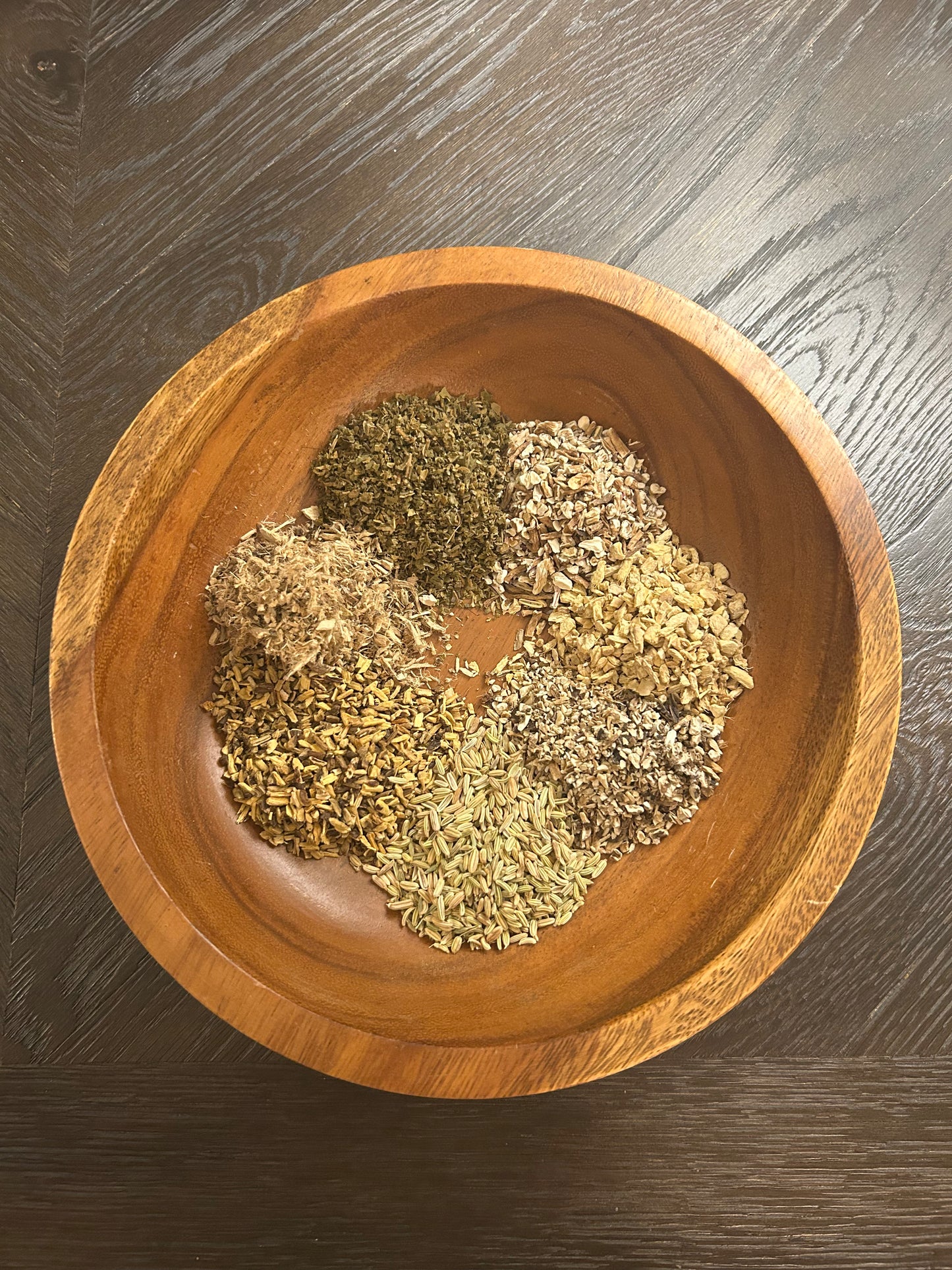 Image of Rooted Regularity Tea in wooden bowl