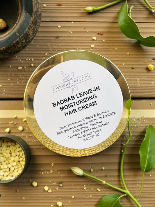 Baobab leave-in moisturizing hair cream container on a wooden surface with leaves and seeds.