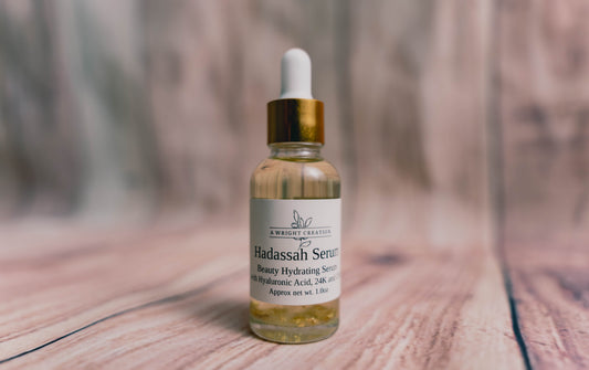 A Wright Creation Hadassah Face Serum in eco-friendly packaging with a gold dropper, featuring hyaluronic acid and 24K gold to hydrate, soothe, and rejuvenate sensitive skin, ideal for eczema, psoriasis, and dry skin care.