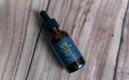 Bottle of LoLo Life CBD oil on a wooden surface