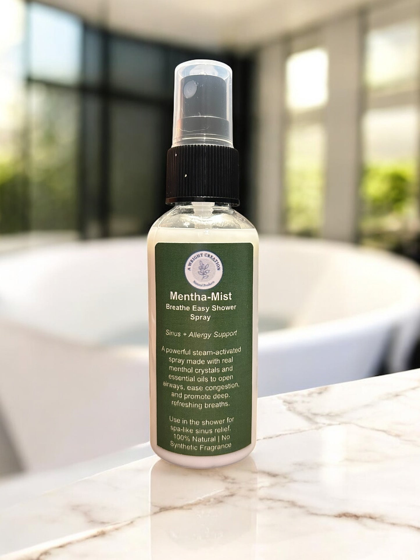 Mentha-Mist Breathing Easy Shower Spray bottle on a marble surface with a blurred background