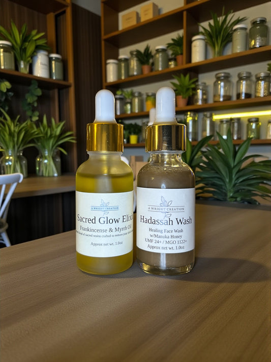 Two bottles of skincare products on a wooden table with a shelf in the background.